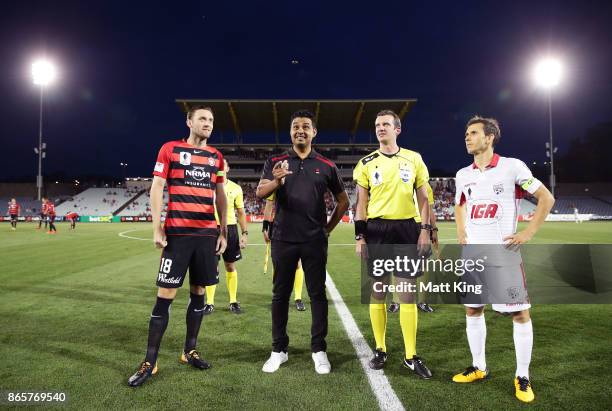 Captains Robbie Cornthwaite of the Wanderers and Isaias of United take part in the coin toss during the FFA Cup Semi Final match between the Western...