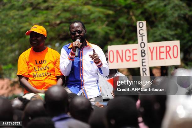 Kisumu governor Anyang Nyongo addresses NASA supporters outside the IEBC offices during protests called for by NASA presidential candidate Odinga to...