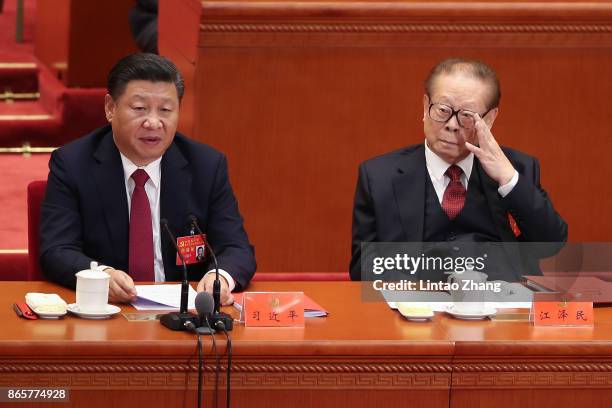 Chinese President Xi Jinping with China's former president Jiang Zemin attends the closing of the 19th Communist Party Congress at the Great Hall of...