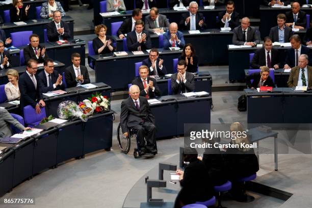 Newly elected Bundestag president Wolfgang Schaeuble moves to the President seat at the opening session of the new Bundestag on October 24, 2017 in...