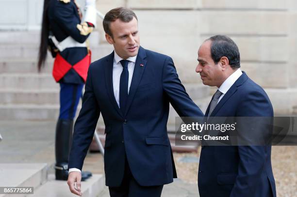 French President Emmanuel Macron welcomes Egyptian President Abdel Fattah al-Sisi prior to a meeting at the Elysee Presidential Palace on October 24,...
