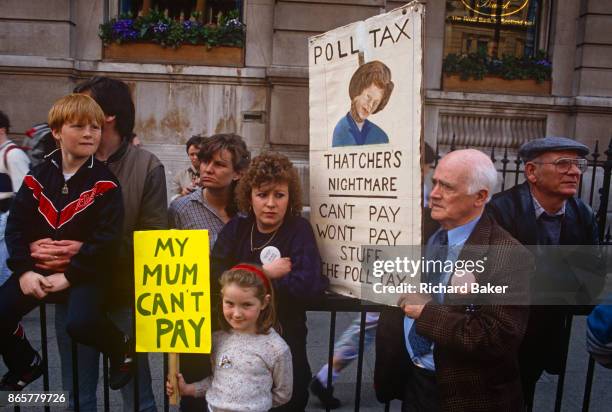 Before it erupts into a full-scale riot, families protest against Margaret Thatcher's Poll Tax policy, on 31st March 1990, in Trafalgar Square,...