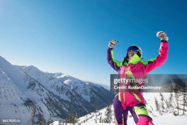 success tourist woman on top of the mountain. - ski-wear stock pictures, royalty-free photos & images