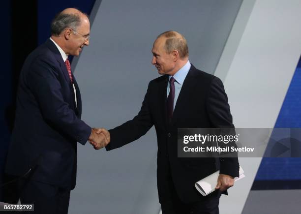 Russian President Vladimir Putin greets CEO of London Stock Exchange Group Xavier Rolet during the VTB Russia Calling! Forum in Moscow, Russia,...