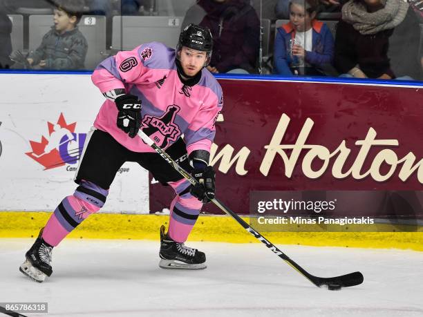 Antoine Crete-Belzile of the Blainville-Boisbriand Armada skates the puck against the Quebec Remparts during the QMJHL game at Centre d'Excellence...