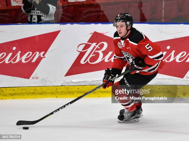 Sam Dunn of the Quebec Remparts skates the puck against the Blainville-Boisbriand Armada during the QMJHL game at Centre d'Excellence Sports Rousseau...