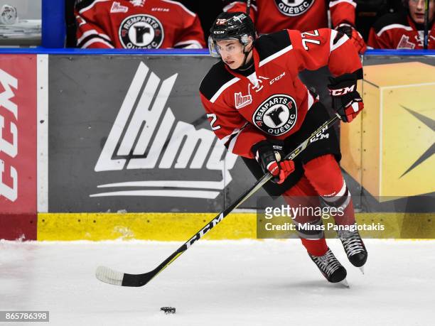 Pierrick Dube of the Quebec Remparts skates the puck against the Blainville-Boisbriand Armada during the QMJHL game at Centre d'Excellence Sports...