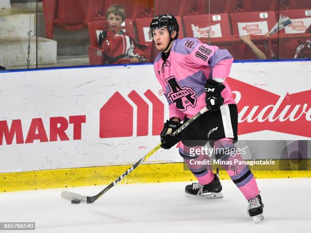 Quinn Hanna of the Blainville-Boisbriand Armada looks to play the puck against the Quebec Remparts during the QMJHL game at Centre d'Excellence...