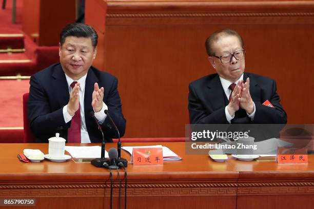 Chinese President Xi Jinping with China's former president Jiang Zemin attends the closing of the 19th Communist Party Congress at the Great Hall of...