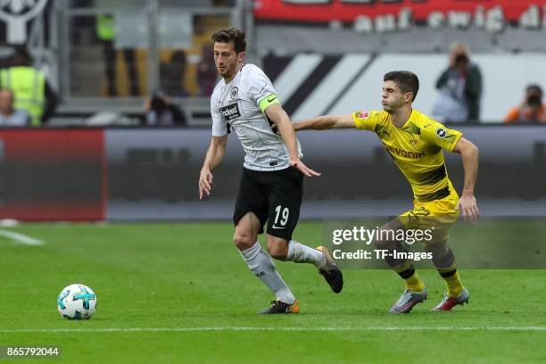 David Angel Abraham of Frankfurt and Christian Pulisic of Dortmund battle for the ball during the Bundesliga match between Eintracht Frankfurt and...