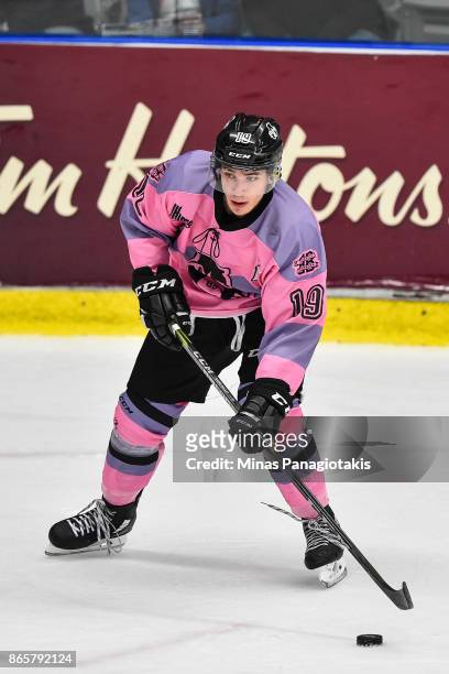 Alex Barre-Boulet of the Blainville-Boisbriand Armada looks to play the puck against the Quebec Remparts during the QMJHL game at Centre d'Excellence...