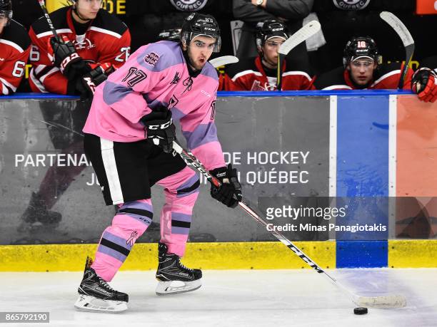 Thomas Ethier of the Blainville-Boisbriand Armada skates the puck against the Quebec Remparts during the QMJHL game at Centre d'Excellence Sports...