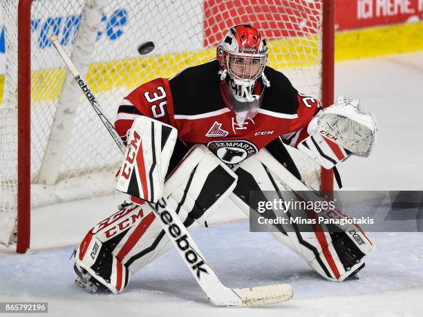 Olivier Chalifour of the Quebec Remparts watches the puck against the Blainville-Boisbriand Armada during the QMJHL game at Centre d'Excellence...