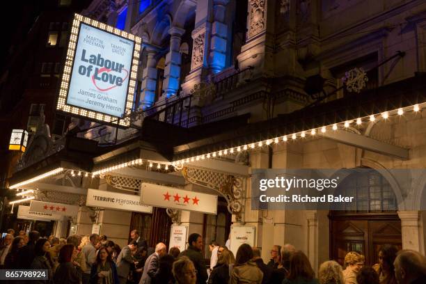 Theatre-goers outside the Noel Coward Theatre in St. Martin's Lane queue to see Labour of Love, a political comedy by James Graham and starring...