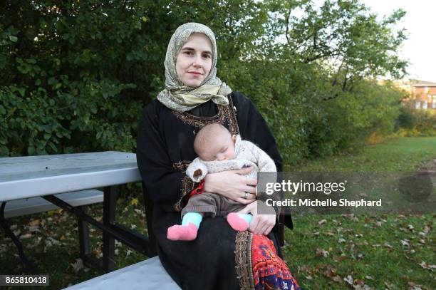 Caitlan Coleman, the wife of Canadian Joshua Boyle, holds her infant daughter as she speaks to the Star from the grounds of a hospital in Ottawa, in...