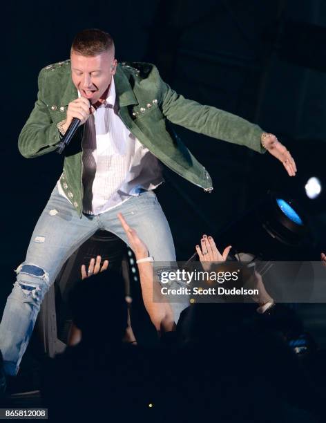 Rapper Macklemore performs onstage during the 5th annual "We Can Survive" benefit concert presented by CBS Radio at the Hollywood Bowl on October 21,...