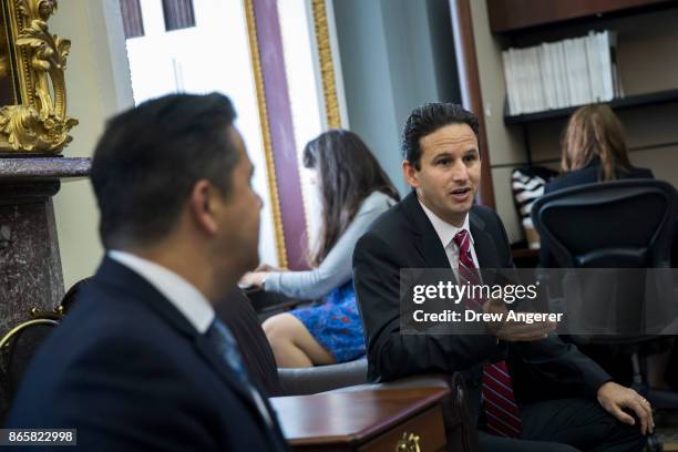 Rep. Ben Ray Lujan looks on as Sen. Brian Schatz speaks with reporters about health care on Capitol Hill, October 24, 2017 in Washington, DC.