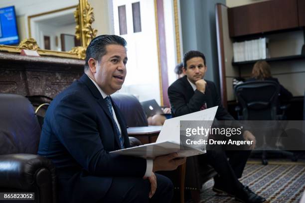 Rep. Ben Ray Lujan speaks to reporters about health care as Sen. Brian Schatz looks on, on Capitol Hill, October 24, 2017 in Washington, DC.