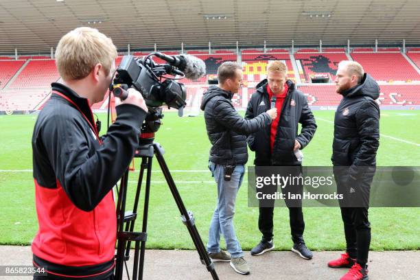 Sunderland players Duncan Watmore and Jonny Williams are interviewed during a fans festival at The Stadium of Light on October 23, 2017 in...
