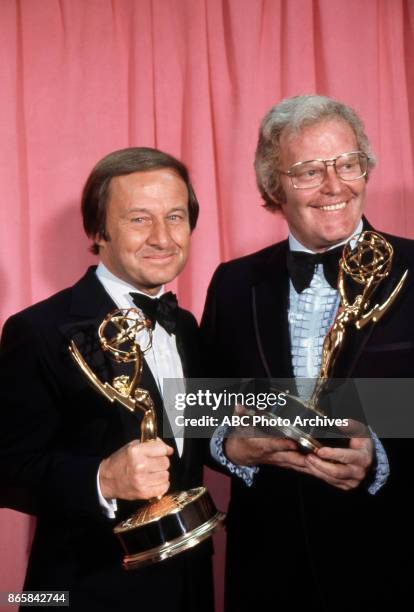 Sports commentator Jim Mckay and Wide World of Sports producer Roone Arledge hold their Emmy Awards in the press room at The 25th Primetime Emmy...