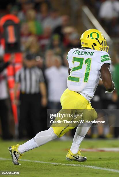 Royce Freeman of the Oregon Ducks carries the ball against the Stanford Cardinal during the first quarter of their NCAA football game at Stanford...