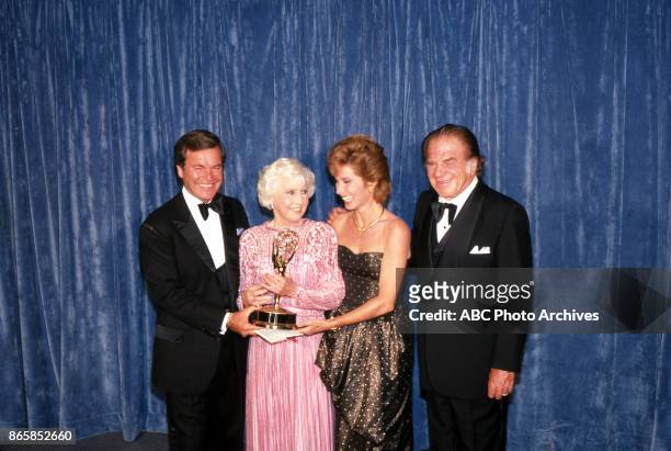 Robert Wagner, Barbara Stanwyck, Stephanie Powers and Lionel Stander at The 35th Primetime Emmy Awards on September 25, 1983 at Pasadena Civic...