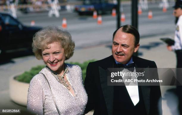 Betty White and John Hillerman arrive at The 37th Primetime Emmy Awards on September22, 1985 at Pasadena Civic Auditorium, Pasadena, California.