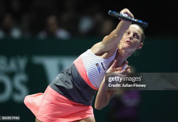 Karolina Pliskova of Czech Republic serves in her singles match against Garbine Muguruza of Spain during day 3 of the BNP Paribas WTA Finals...