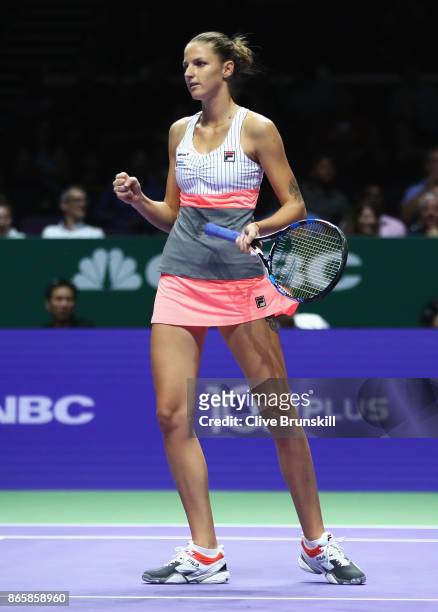 Karolina Pliskova of Czech Republic celebrates a point in her singles match against Garbine Muguruza of Spain during day 3 of the BNP Paribas WTA...