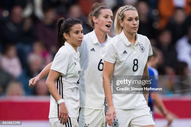 Hasret Kayikci, Simone Laudehr and Lena Goessling of Germany celebrate a goal during the 2019 FIFA Women's World Championship Qualifier match between...