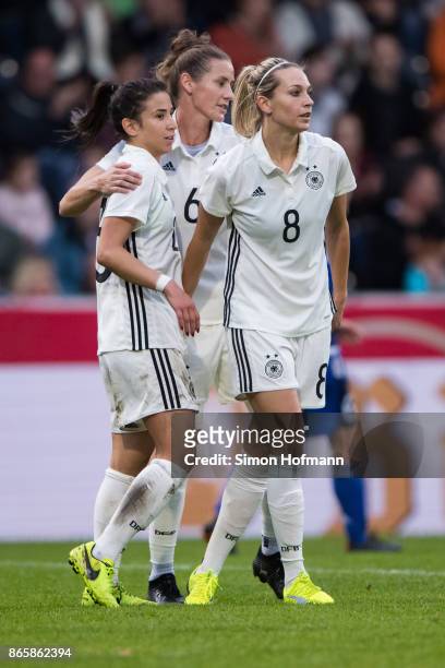 Hasret Kayikci, Simone Laudehr and Lena Goessling of Germany celebrate a goal during the 2019 FIFA Women's World Championship Qualifier match between...