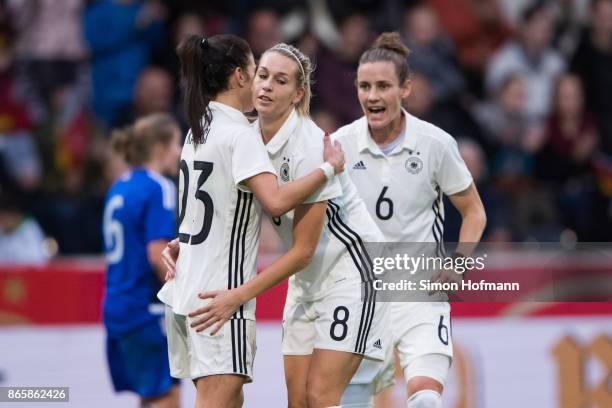 Hasret Kayikci, Lena Goessling and Simone Laudehr of Germany celebrate a goal during the 2019 FIFA Women's World Championship Qualifier match between...