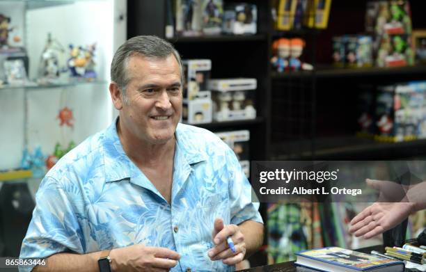 Actor Bruce Campbell signs his book "Hail To The Chin" held at Dark Delicacies Bookstore on October 23, 2017 in Burbank, California.