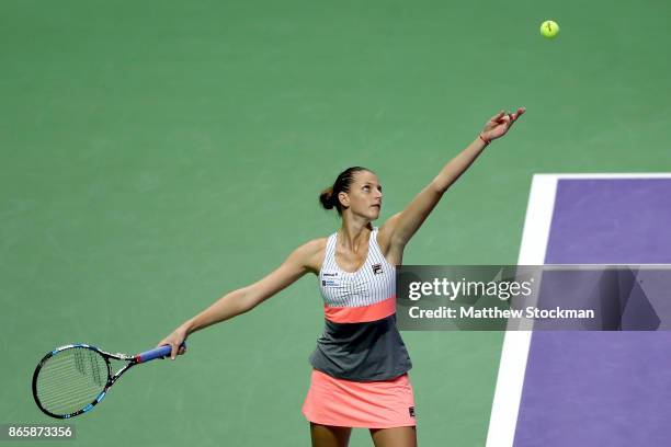 Karolina Pliskova of Czech Republic serves in her singles match against Garbine Muguruza of Spain during day 3 of the BNP Paribas WTA Finals...