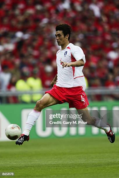 Jin Cheul Choi of South Korea runs with the ball during the FIFA World Cup Finals 2002 Quarter-Finals match between Spain and South Korea played at...