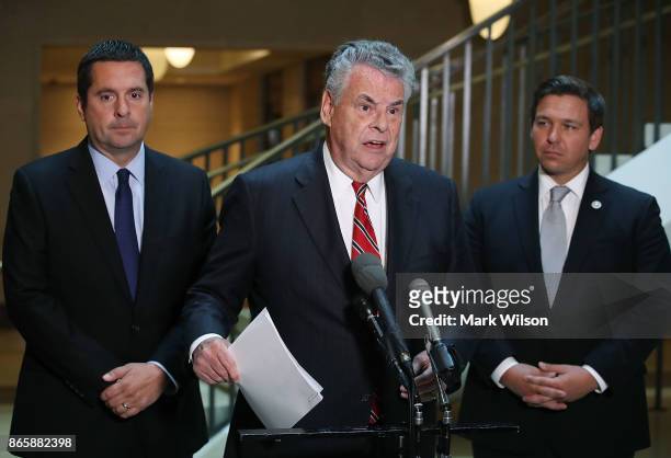 Rep. Peter King speaks while flanked by Rep. Don DeSantis and House Intelligence Committee Chairman Devin Nunes as they announce that the House...