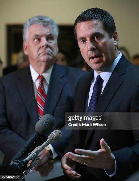 House Intelligence Committee Chairman Devin Nunes while flanked by Rep. Peter King , as he announces that his committee and the House oversight...