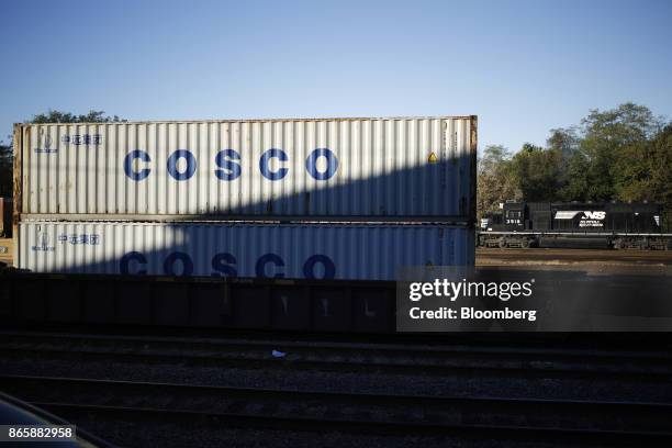 China Ocean Shipping Group Co. Containers sit stacked in a Norfolk Southern Corp. Rail yard in Danville, Kentucky, U.S., on Tuesday, Oct. 17, 2017....
