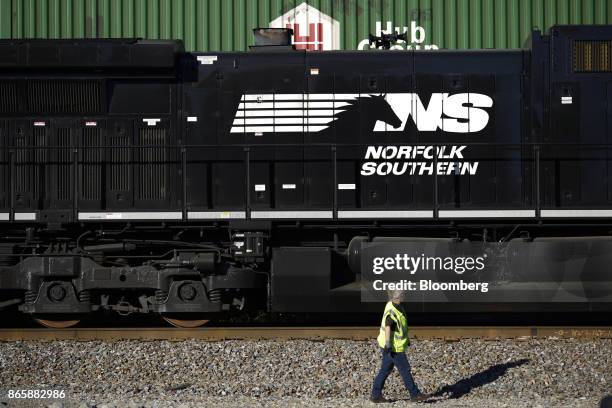 Conductor walks past a Norfolk Southern Corp. Freight locomotive during a crew change in Burnside, Kentucky, U.S., on Tuesday, Oct. 17, 2017. Norfolk...