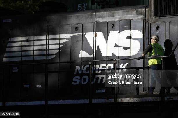 Conductor checks a Norfolk Southern Corp. Freight locomotive during a crew change in Burnside, Kentucky, U.S., on Tuesday, Oct. 17, 2017. Norfolk...