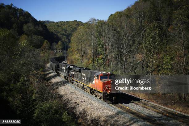 Canadian National Railway Co. Locomotive leads a Norfolk Southern Corp. Coal train through a cut in Superior, West Virginia, U.S., on Thursday, Oct....
