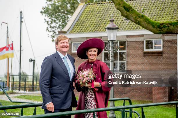 King Willem-Alexander of The Netherlands and Queen Maxima of The Netherlands pose at the water pomp system Gemaal Eemnes during there region visit to...