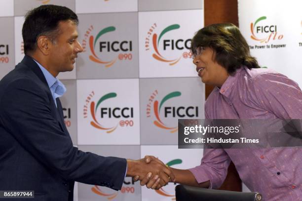 Former Indian Cricket Captain Rahul Dravid, shakes hands with fast bowler, Indian Womens Cricket Team Jhulan Goswami, during the FICCI Ladies...