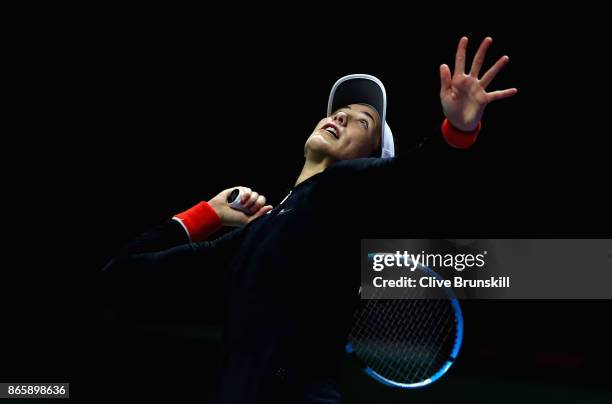 Garbine Muguruza of Spain serves in her singles match against Karolina Pliskova of Czech Republic during day 3 of the BNP Paribas WTA Finals...