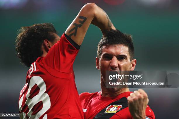 Lucas Alario of Bayer 04 Leverkusen celebrates scoring his teams second goal of the game during the DFB Cup match between Bayer Leverkusen and 1. FC...