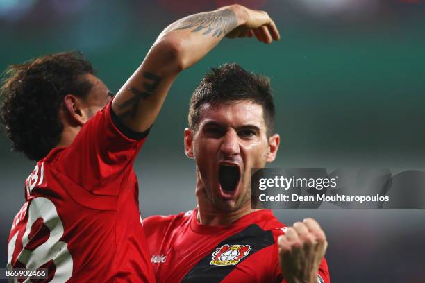 Lucas Alario of Bayer 04 Leverkusen celebrates scoring his teams second goal of the game during the DFB Cup match between Bayer Leverkusen and 1. FC...