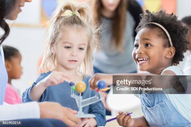 young students learn about the solar system - science teacher stock pictures, royalty-free photos & images