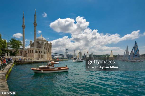 the ortakoy mosque and salings yachts in istanbul,turkey - bosporen bildbanksfoton och bilder