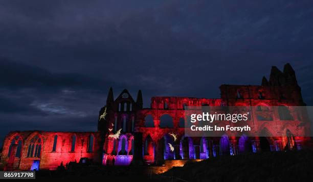 Light display illuminates the ruins of the historic Whitby Abbey on October 24, 2017 in Whitby, England. The famous Benedictine abbey was the...