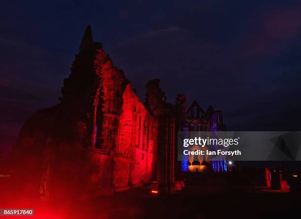 Light display illuminates the ruins of the historic Whitby Abbey on October 24, 2017 in Whitby, England. The famous Benedictine abbey was the...